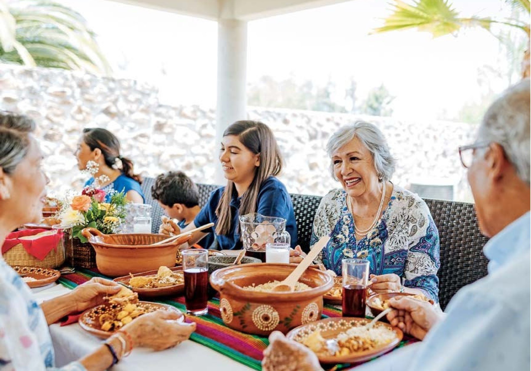 Family sharing a meal outdoors
